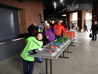 James and the gang after finishing setting up and waiting on walkers to come through at the Huntington Park baseball stadium
